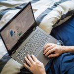 Business owner managing a website on a laptop