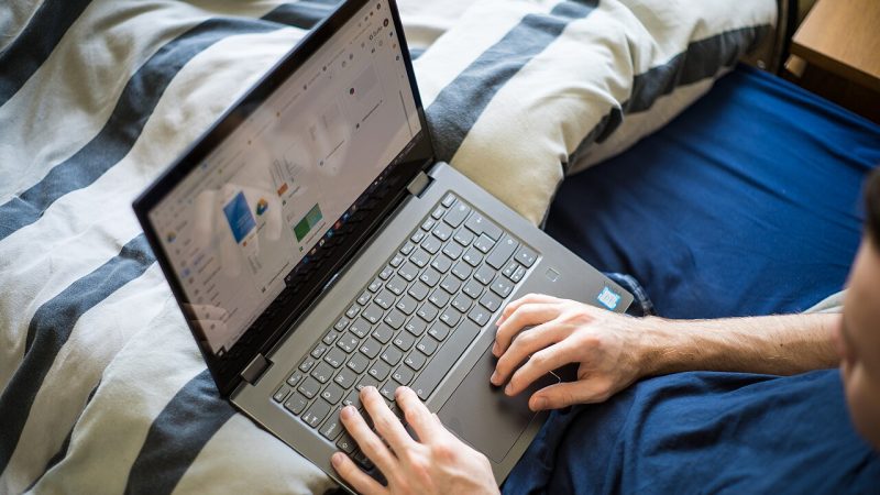 Business owner managing a website on a laptop