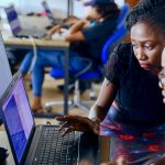 Programmers working together on custom software